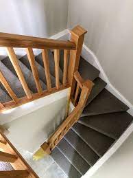 Custom treads, wood handrail, box newel posts, & balusters. Oak Double Winder Featuring A Return Balustrade A Stunning Staircase Stairs Design Staircase Design Modern Staircase Remodel