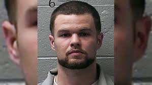 Slain KKK leader's widow admits killing him, gets life in prison