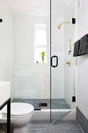 I have a pre made tile redi shower pan in place. Black Mini Penny Tile Baseboards Transitional