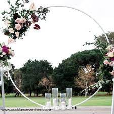 A modern take on the neutral wedding color palette with large floral installations, edgy settings, luxe lounge spaces and. White Metal Circle Wedding Arch Auckland Event Hire
