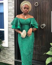 60 Latest Aso Ebi Styles For 2020 Updated Weekly Thrivenaija Lace Dress Styles Nigerian Dress Styles African Print Fashion Dresses