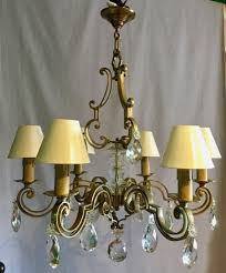 Contains real gold, but very little (about one gram of real gold in one pint of solution can be used to plate thousands of pieces!). 40s 50s Large Chandelier Ceiling Lights