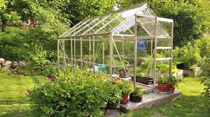 A shelf above the bench is a useful spot for seedlings. Why Greenhouses Have Become A Popular Trend Build Magazine