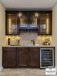 Bridgewater S Custom Bar In The Finished Lower Level Includes Glass Front Cabinets With Led Cabinet And Und Basement Bar Designs Home Bar Designs Basement Bar