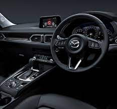 All special edition models are finished in snowflake white pearl mica, with a rich burgundy interior. Mazda Cx 5