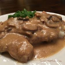 Add sliced mushrooms, followed by the pork chops and top with a can of cream of mushroom soup. Easy Slow Cooker Smothered Pork Chops With Mushroom And Onion Gravy Sweet Little Bluebird