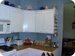 Well, naturally, we are going to show you brown kitchen cabinets. White Cabinets Blue Walls Brown Countertop Although I D Make It A Richer Chocolate Brown I Like How The Handles Brown Countertop Kitchen Kitchen Cabinets