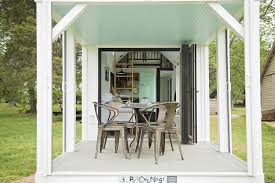My sun porch is a multipurpose room at my house. This Farmhouse Style Tiny Home Has Its Own Built In Porch Area