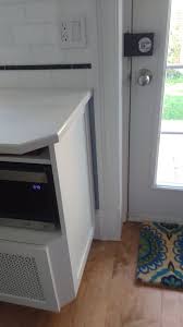 The microwave has an exhaust hood underneath it for. Radiator Inside Cabinet Heating Help The Wall