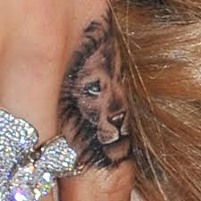Cara delevingne shares photos of her first tattoo and thanks rihanna for the salon recommendation just weeks after friend and singer, rita ora, got a new ink to add to her growing collection of tattoos. Cara Delevingne Lion Knuckle Tattoo Steal Her Style