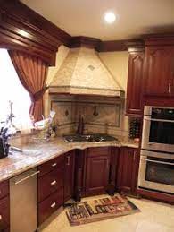 Elegant shiny color of metal backsplash can compliment dark and light cabinet paints. 24 Corner Cooktops Ideas Corner Stove Kitchen Remodel Kitchen Design