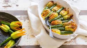 Often stuffed with cheese, herbs, seafood or meat, and fried. Zucchini Flowers Stuffed With Herbs And Rice Recipe Sbs Food