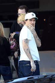 Brooklyn beckham's sweet tattoo tribute to family | hello! Brooklyn Beckham Shows Off Tattoos In White Tee On Outing With Fiancee Nicola Peltz In Hollywood Geeky Craze