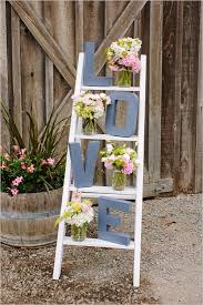 Old wooden ladder used to make a shoe rack. 40 Chic Ways To Use Ladder On Rustic Country Weddings Deer Pearl Flowers