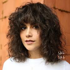 The curly and frizzy hair looks nice with low ponytail in bangs. 25 Best Variations Of The Shoulder Length Bob In 2021