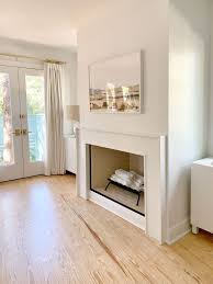 Shiplap looks nice on the wall. How We Built An Easy Modern Fireplace Mantel Just In Time For Stockings Young House Love