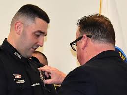 Badges passed from fathers to sons in Manchester