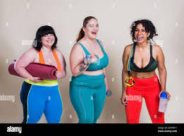 Plus size women making sport and fitness. Studio portraits with multiethnic  curvy girls Stock Photo - Alamy