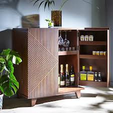 The two large handles have a mirrored finish for a glam element, and come together to create a circle on the front of this accent cabinet. The Best Drinks Cabinets Around Shed