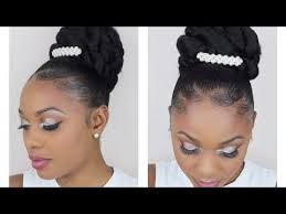 Throwing in some color is a good way to personalize the look. Easy Bridal Wedding Bun Updo Protective Styles Youtube Simple Wedding Hairstyles Natural Hair Styles Wedding Bun Updo