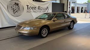Image result for Medium Gold 1998 Town Car
