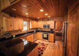 Pine Kitchen Cabinets And Black Granite Countertops Complete The Look Of This Lake Home On Big Floyd Lake M Pine Kitchen Pine Kitchen Cabinets Kitchen Remodel