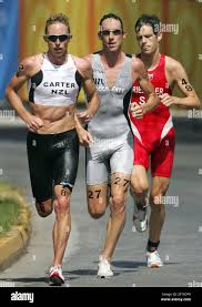 KRT SPORTS STORY SLUGGED: OLY-TRIATHLON KRT PHOTO BY DAVID EULITT/KANSAS  CITY STAR (August 26) ATHENS, GREECE -- Hamish Carter of New Zealand, left,  leads countryman Bevan Docherty and Sven Riederer of Switzerland,