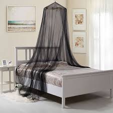 Canopy bed drapes provide a focal point for a room. Oasis Round Hoop Sheer Bed Canopy