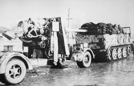 Totenkopf Sd.Kfz.7 and an 8.8 cm FLAK during Kharkiv counteroffensive...