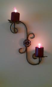 Wrought iron candle decor pieces that are hand forged for you by blacksmiths in a variety of styles, including colonial, craftsman, victorian, and country period styles. Wrought Iron Wall Mounted Candle Holder Wall Mounted Candle Holders Iron Candle Holders Wrought Iron Candle