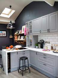 French grey shaker kitchen pantry cabinet with natural oak interior, worktop and power supply, pocket doors and under shelf lighting. 25 Grey Kitchen Ideas That Prove This Color Literally Never Dates Real Homes