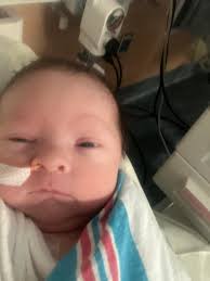 Who said "she looks more like a chicken than a baby"?