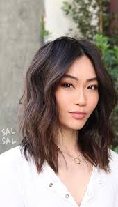 Women with round faces will appreciate the way a medium haircut with bangs and angled layers elongates and slims down the face. Best Haircuts Hairstyles To Try In 2021 Shoulder Length Layers