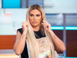 Katie price tries to detract attention away from her very swollen lips stepping out in garish pink tracksuit. What Is Katie Price S Net Worth And How Old Is She
