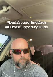 Man Snapping Fan at Father