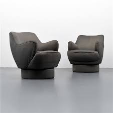 Pair a desk with a chair, and even mix in a hanging plant or some art, and you've got a simple arrangement that will blend in seamlessly with your living room. Kagan Vladimir Pair Of Swivel Arm Chairs Mutualart