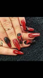 The most common black acrylic nails material is plastic. Black Red Acrylic Nails With Bows Red Acrylic Nails Red Black Nails Trendy Nails