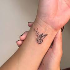 Fine Line Butterfly Tattoo On The Wrist