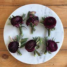 Wedding Boutonnieres For The Groomsmen And Officiant Made With Burgundy Ranunculus S Succulent Bouquet Wedding Ranunculus Wedding Green And Burgundy Wedding