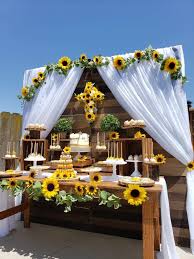 Feast Your Eyes On This Splendid Sunflower 1st Communion Celebration The Dessert Table Is Beau Sunflower Wedding Decorations Sunflower Wedding Sunflower Party
