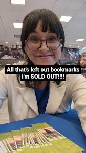 Published Author Wears Folklore Album Quarterzip to Book Signing