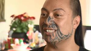 Man with facial tattoo rises above flak