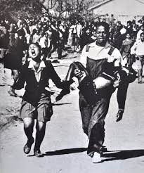 Was peacefully protesting until the police. 18 Year Old Mbuyisa Makhubo Carries South African Hector Pieterson In A Famous Photograph Taken After The Pi Soweto South African Apartheid Black History Facts