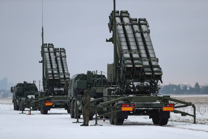 A Patriot missile system battery deployed in a field, representing the critical need for advanced air defense systems in Ukraine.