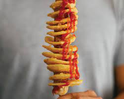 They also go by other names such as chip sticks, spiral spuds, potato springs, twisted tators, saratogo swirls, and just plain tornado potatoes. Tornado Potato Hot Dog Sticks Fete Food Recipes Sbs Food