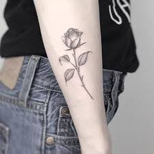 Click here for 50 beautiful rose tattoos + their symbolism. Tatouage Rose Cote Tatouage Rose Tatouage Rose Avant Bras Tatouage Rose Poignet
