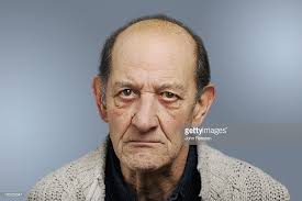 Angry senior sitting on a panel isolated on white background. Stock Photo Happy And Grumpy Old Men Grumpy Man Grumpy Old Men Old Man Pictures