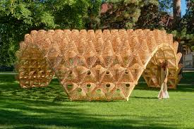 Sunlight Filters Through A Shell Like Pavilion Covered With Wicker Baskets In Annecy France Colossal In 2020 Pavilion Outdoor Pavilion Annecy
