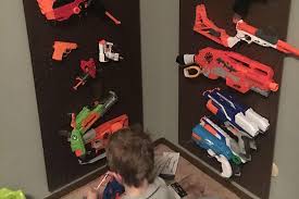 Now take out all of your airsoft guns, nerf guns, foam swords, minecraft pickaxes, and whatever else you would like to hang and start to add it. Build A Nerf Gun Rack Super Cheap