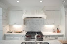 The backsplash tile is my favorite marble, calacatta gold in 2″ x 8″ pieces, set on the wall in a stepped brick layout. Linear Marble Tile Backsplash Transitional Kitchen Amanda Orr Architects